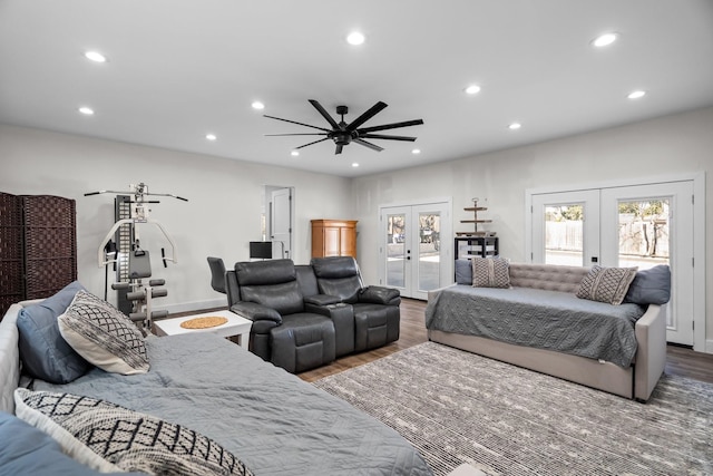 bedroom featuring french doors, wood finished floors, and access to exterior