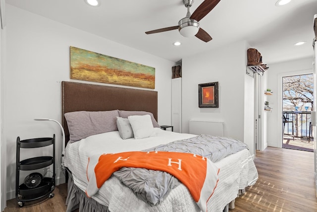 bedroom featuring recessed lighting, wood finished floors, ceiling fan, and access to outside