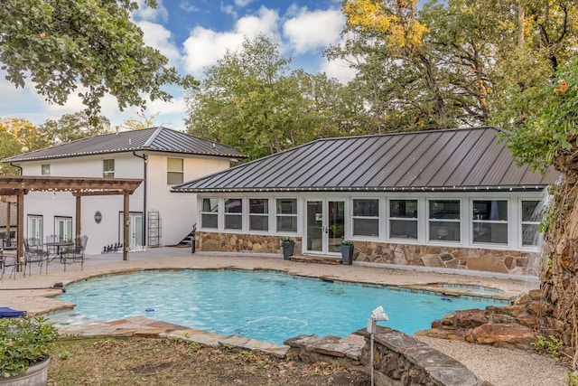 outdoor pool with french doors, a pergola, and a patio