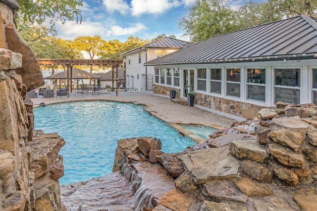 outdoor pool with an in ground hot tub, a pergola, and a patio