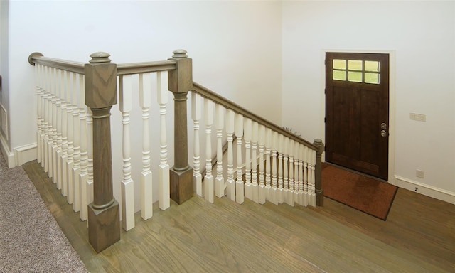 entryway featuring wood finished floors and baseboards