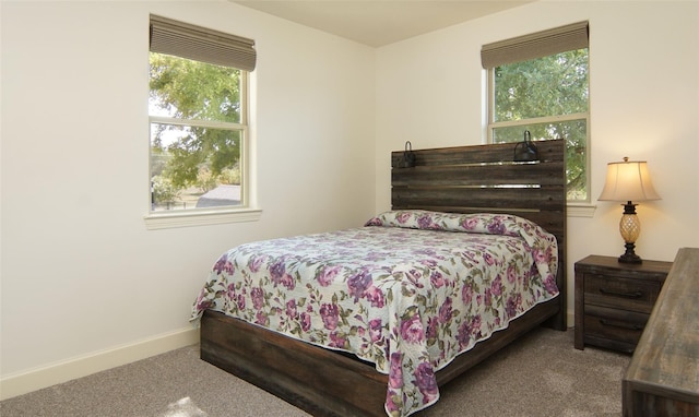 bedroom with carpet and baseboards