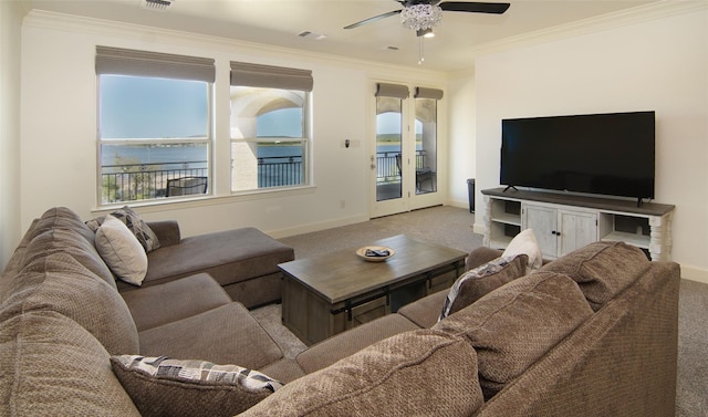 carpeted living room featuring crown molding, baseboards, and visible vents