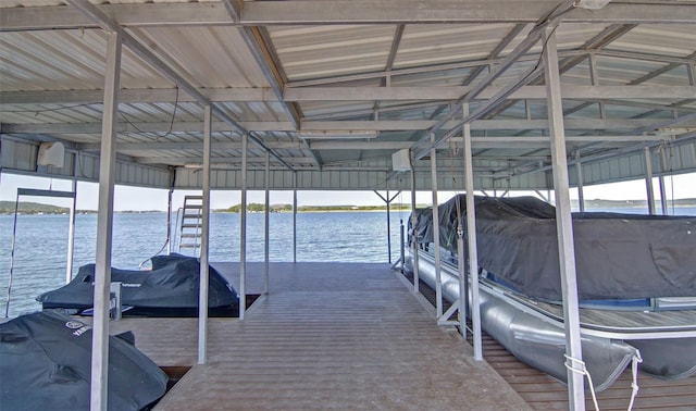 view of dock featuring boat lift and a water view