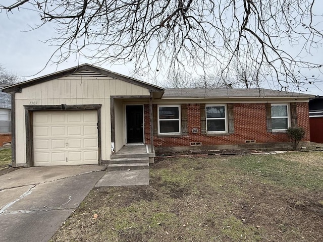 ranch-style house with crawl space, a garage, brick siding, and driveway