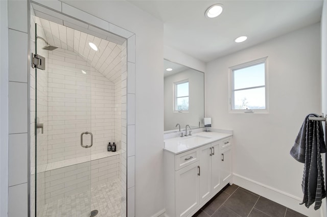 bathroom featuring vanity, baseboards, recessed lighting, a stall shower, and tile patterned flooring