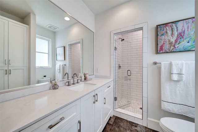 bathroom with recessed lighting, vanity, toilet, and a shower stall