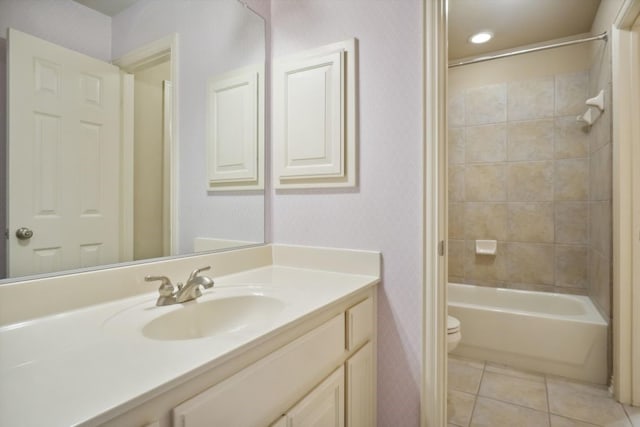 bathroom featuring vanity, tile patterned floors, toilet, and shower / bathtub combination