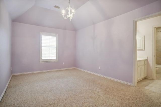 unfurnished room with visible vents, baseboards, vaulted ceiling, a notable chandelier, and light colored carpet