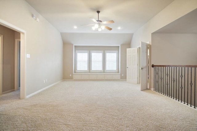 unfurnished room featuring baseboards, light colored carpet, vaulted ceiling, recessed lighting, and a ceiling fan