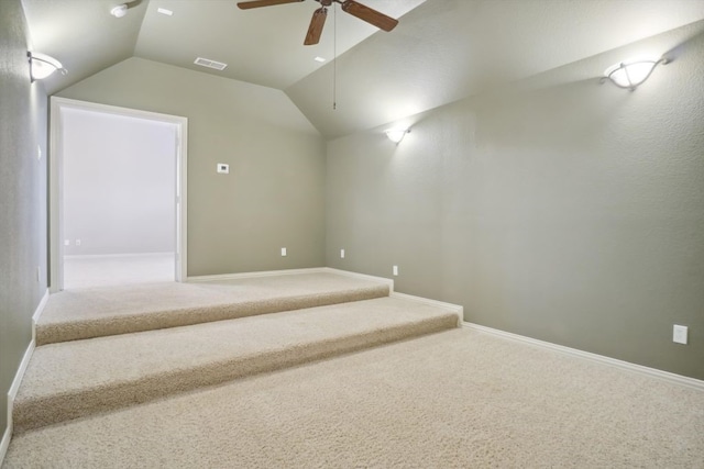 bonus room with visible vents, baseboards, lofted ceiling, carpet floors, and a ceiling fan