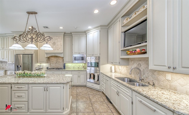 kitchen with white cabinetry, appliances with stainless steel finishes, and a sink