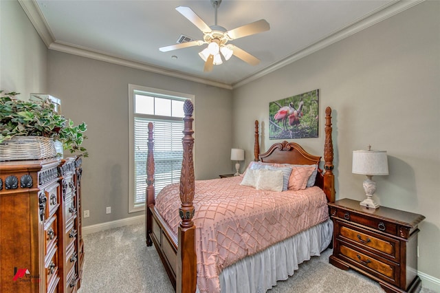 carpeted bedroom featuring baseboards, ornamental molding, and a ceiling fan