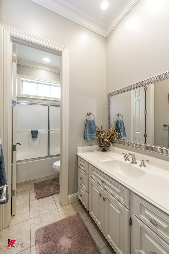 bathroom with toilet, crown molding, tile patterned flooring, enclosed tub / shower combo, and vanity