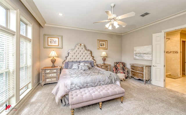 carpeted bedroom with visible vents, recessed lighting, ceiling fan, ornamental molding, and ensuite bathroom