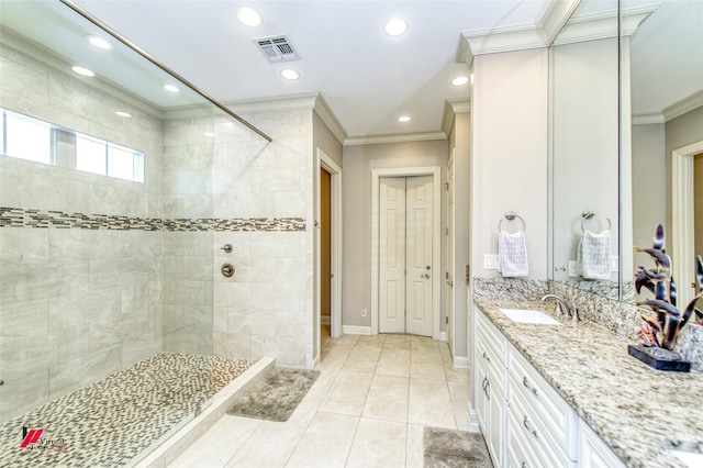 full bathroom featuring tile patterned flooring, ornamental molding, a tile shower, recessed lighting, and vanity