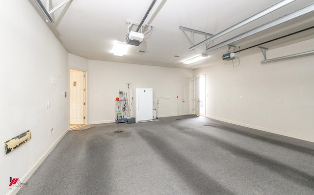 garage with baseboards and a garage door opener