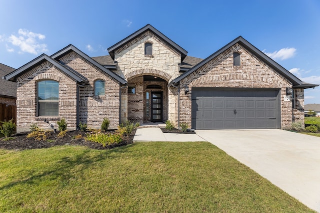 french country inspired facade featuring concrete driveway, a garage, brick siding, and a front lawn