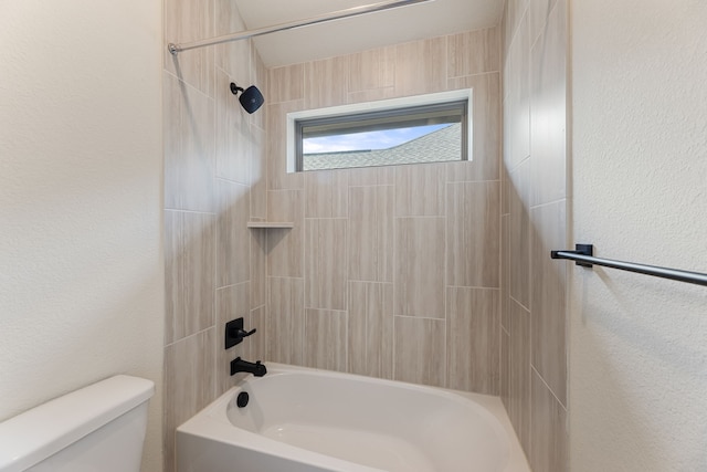 full bath featuring toilet,  shower combination, and a textured wall