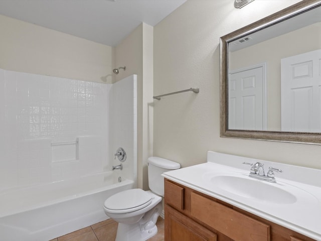 bathroom with visible vents, toilet, vanity, tile patterned flooring, and shower / bathtub combination