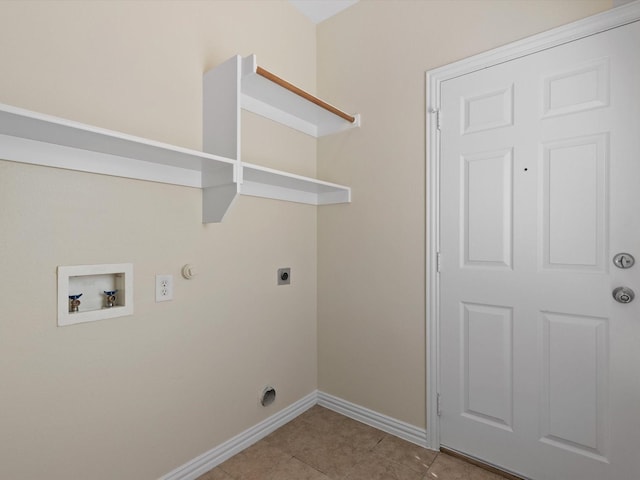 washroom with baseboards, light tile patterned floors, laundry area, hookup for a gas dryer, and hookup for an electric dryer