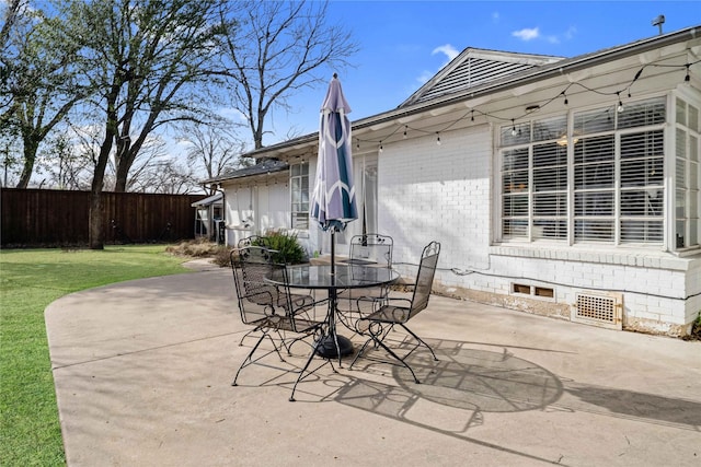 view of patio / terrace with outdoor dining area and fence