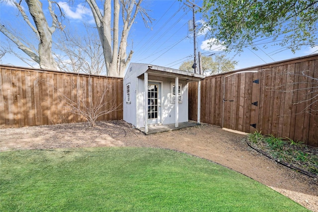 view of shed with a fenced backyard