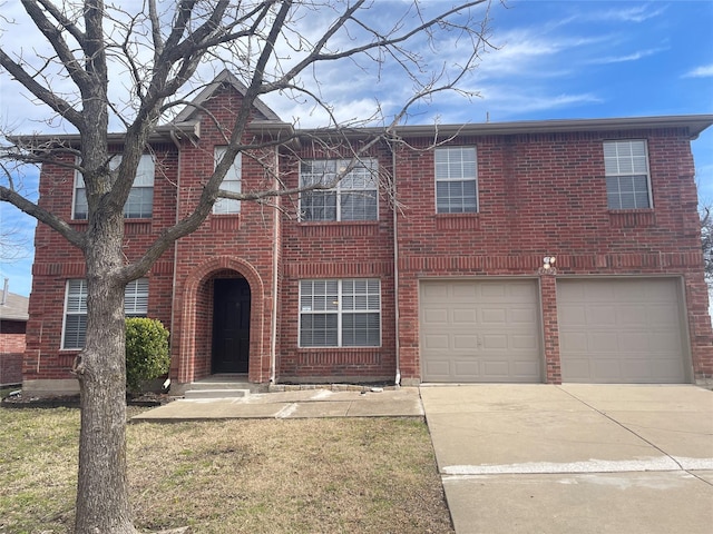 view of front facade featuring brick siding, driveway, and an attached garage