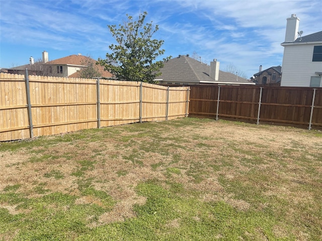 view of yard featuring a fenced backyard