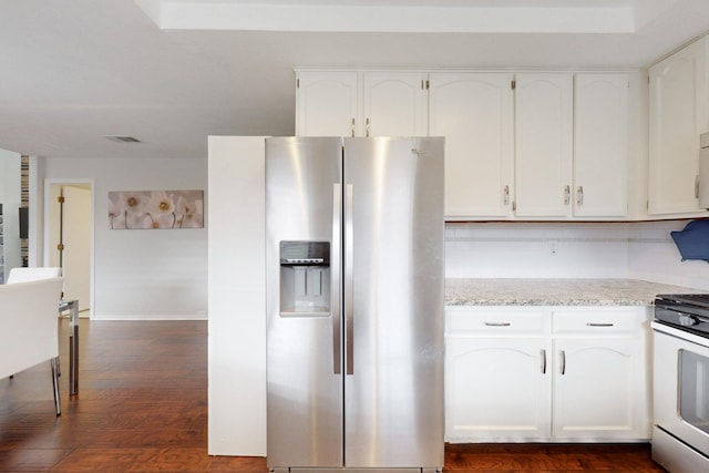 kitchen with gas stove, white cabinets, stainless steel fridge with ice dispenser, and dark wood finished floors