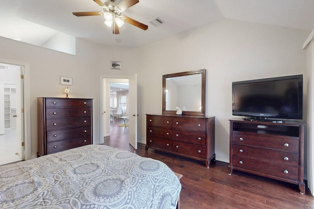 bedroom with vaulted ceiling, wood finished floors, visible vents, and ceiling fan