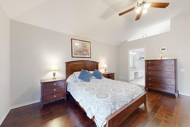 bedroom with lofted ceiling, a ceiling fan, ensuite bath, dark wood finished floors, and baseboards