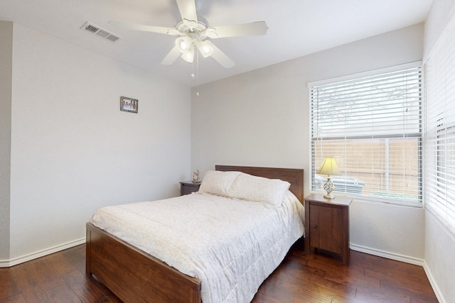 bedroom with visible vents, baseboards, and wood-type flooring