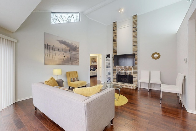 living room with a fireplace, baseboards, and hardwood / wood-style floors