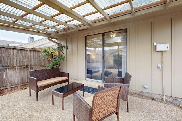 view of patio / terrace featuring an outdoor hangout area, a pergola, and fence