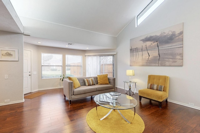 living area with recessed lighting, visible vents, baseboards, and hardwood / wood-style floors