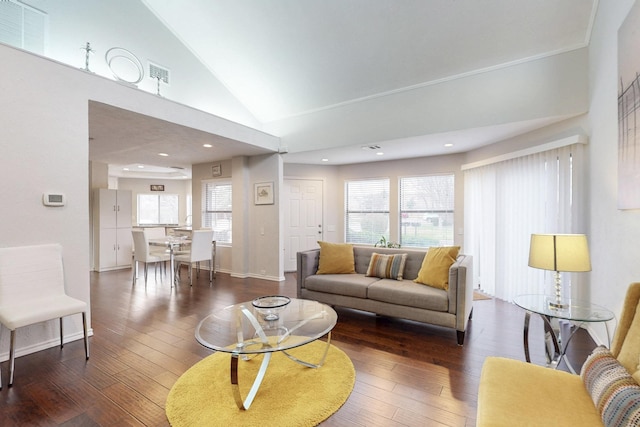 living room with visible vents, high vaulted ceiling, and hardwood / wood-style flooring