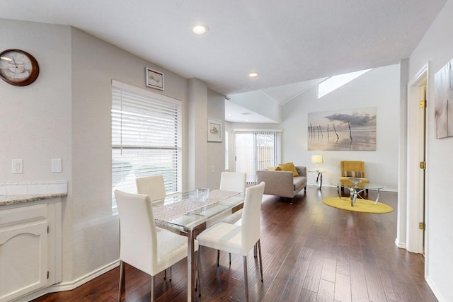 dining space featuring recessed lighting, baseboards, lofted ceiling, and dark wood-style flooring