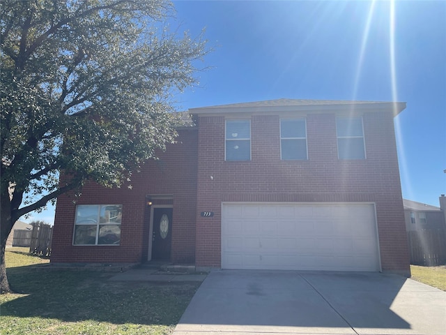 traditional home with a garage, brick siding, concrete driveway, and a front lawn