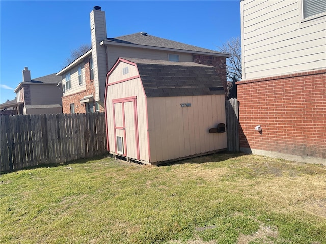 view of shed with a fenced backyard