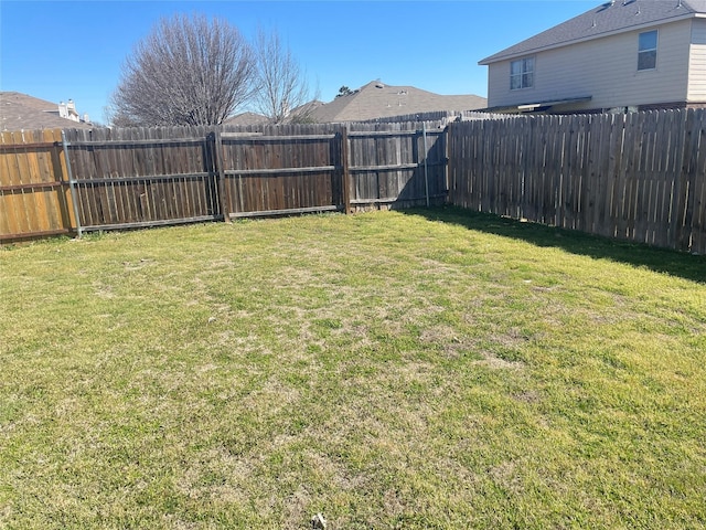 view of yard featuring a fenced backyard