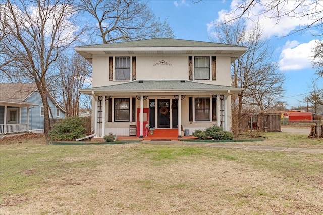 view of front of home featuring a porch, a front lawn, and stucco siding