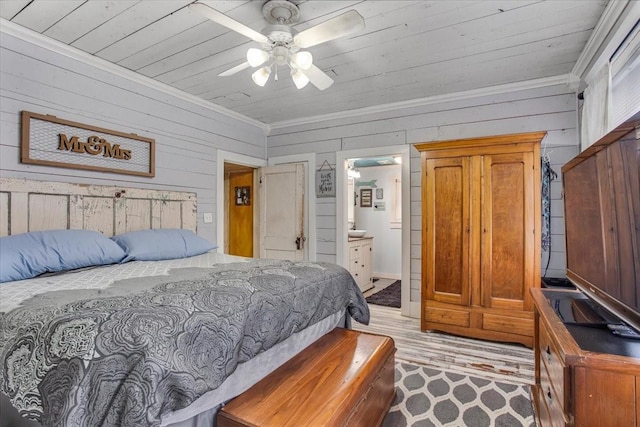 bedroom featuring wooden ceiling, light wood-type flooring, wood walls, and ornamental molding