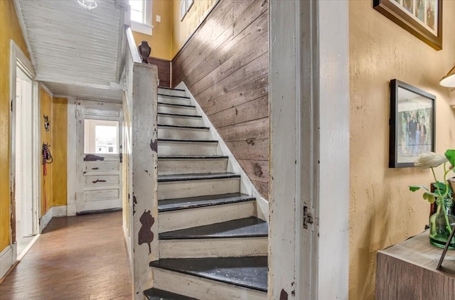 stairway featuring wood finished floors