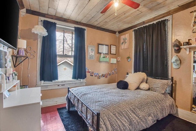 bedroom featuring wood finished floors, wood ceiling, and ornamental molding