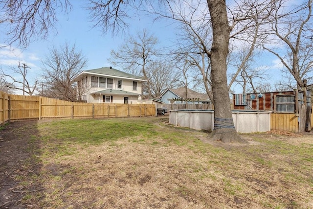 view of yard featuring a fenced in pool and fence private yard