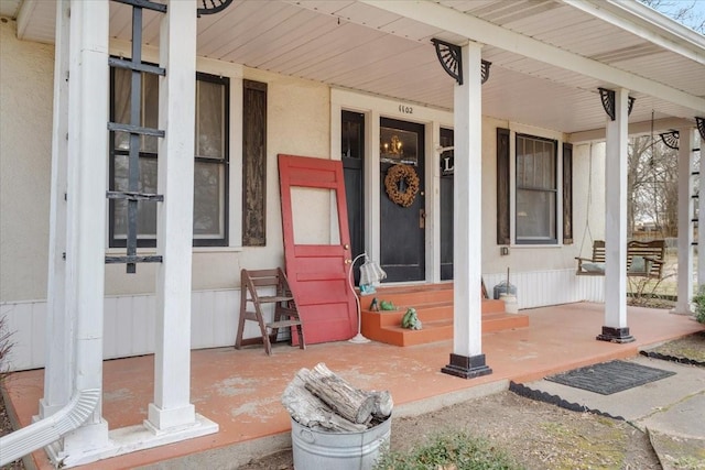 property entrance with a porch