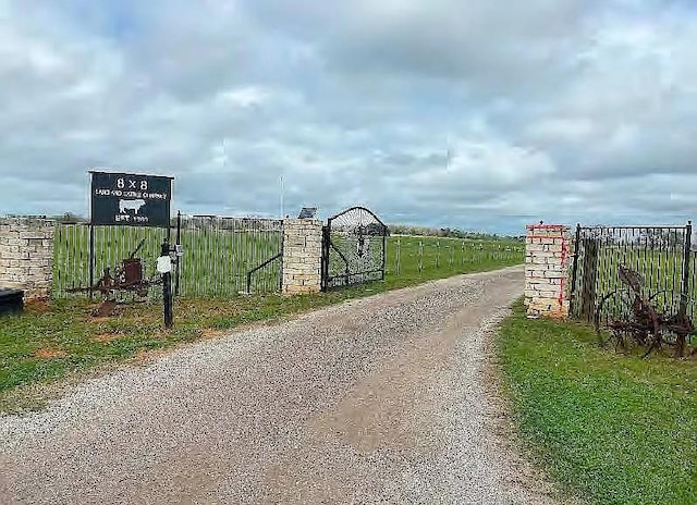 view of street featuring a gate