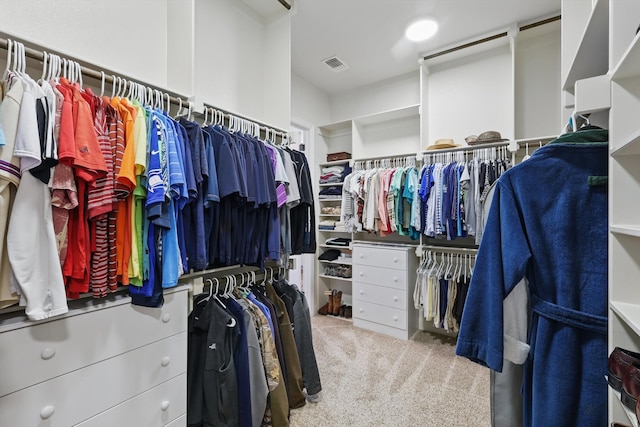 walk in closet with visible vents and carpet floors