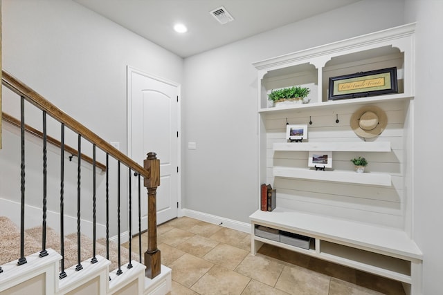 mudroom with light tile patterned floors, visible vents, recessed lighting, and baseboards